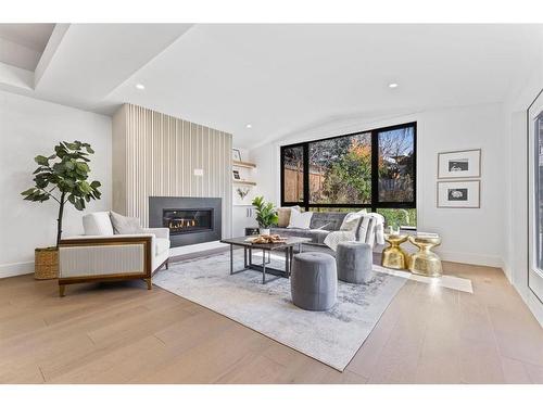 80 Clarendon Road Nw, Calgary, AB - Indoor Photo Showing Living Room With Fireplace