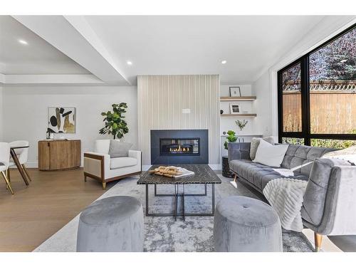 80 Clarendon Road Nw, Calgary, AB - Indoor Photo Showing Living Room With Fireplace