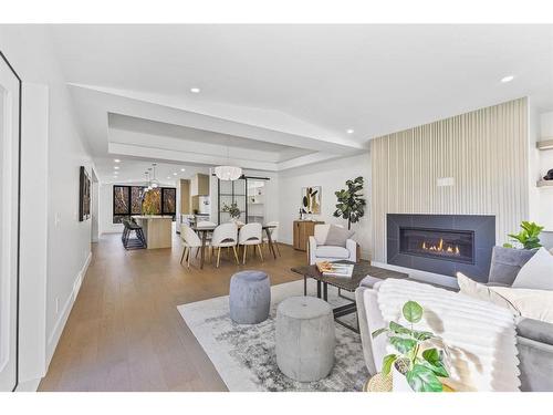 80 Clarendon Road Nw, Calgary, AB - Indoor Photo Showing Living Room With Fireplace