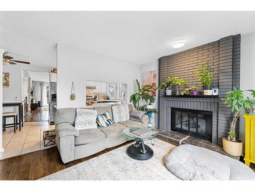 280 Woodbine Boulevard Sw, Calgary, AB - Indoor Photo Showing Living Room With Fireplace