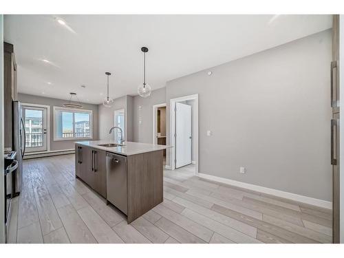 3408-111 Wolf Creek Drive Se, Calgary, AB - Indoor Photo Showing Kitchen With Upgraded Kitchen