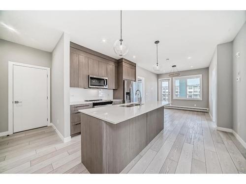 3408-111 Wolf Creek Drive Se, Calgary, AB - Indoor Photo Showing Kitchen With Double Sink With Upgraded Kitchen