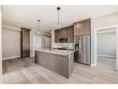 3408-111 Wolf Creek Drive Se, Calgary, AB - Indoor Photo Showing Kitchen With Stainless Steel Kitchen With Upgraded Kitchen