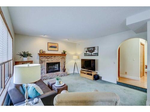 56 Woodford Close Sw, Calgary, AB - Indoor Photo Showing Living Room With Fireplace