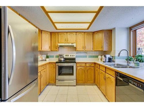 56 Woodford Close Sw, Calgary, AB - Indoor Photo Showing Kitchen With Stainless Steel Kitchen With Double Sink