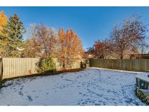 56 Woodford Close Sw, Calgary, AB - Outdoor With Backyard