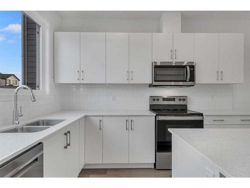 355 Magnolia Drive Se, Calgary, AB - Indoor Photo Showing Kitchen With Double Sink