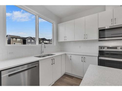 355 Magnolia Drive Se, Calgary, AB - Indoor Photo Showing Kitchen With Double Sink