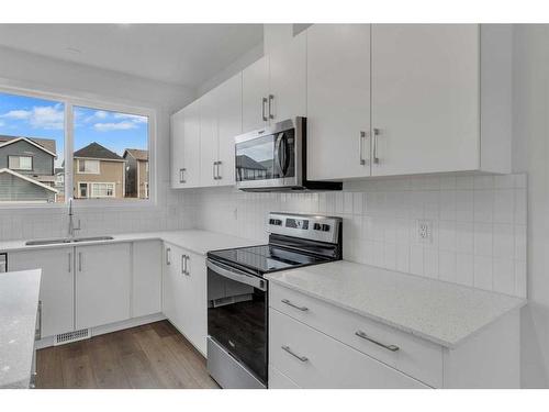 355 Magnolia Drive Se, Calgary, AB - Indoor Photo Showing Kitchen With Double Sink With Upgraded Kitchen