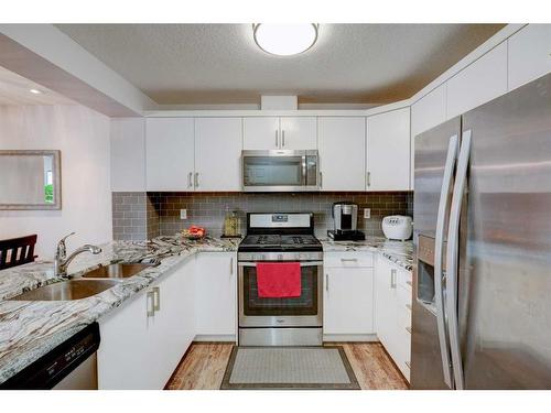 158 Cityscape Boulevard Ne, Calgary, AB - Indoor Photo Showing Kitchen With Double Sink With Upgraded Kitchen