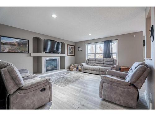 970 Reunion Gateway Nw, Airdrie, AB - Indoor Photo Showing Living Room With Fireplace