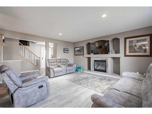 970 Reunion Gateway Nw, Airdrie, AB - Indoor Photo Showing Living Room With Fireplace