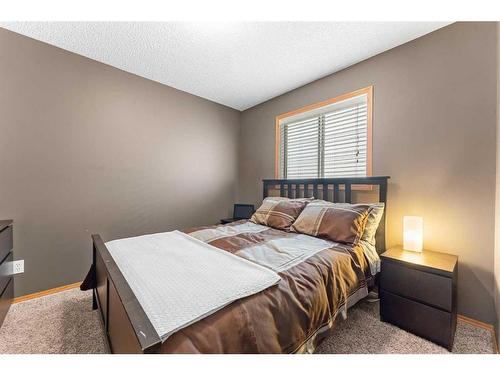 12 Cimarron Meadows Way, Okotoks, AB - Indoor Photo Showing Bedroom