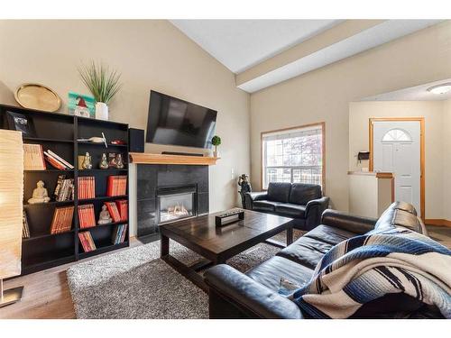 12 Cimarron Meadows Way, Okotoks, AB - Indoor Photo Showing Living Room With Fireplace