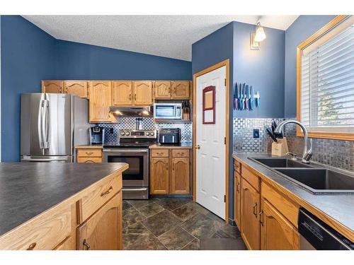 12 Cimarron Meadows Way, Okotoks, AB - Indoor Photo Showing Kitchen With Double Sink