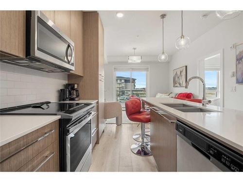 2221-76 Cornerstone Passage Ne, Calgary, AB - Indoor Photo Showing Kitchen With Stainless Steel Kitchen With Double Sink With Upgraded Kitchen