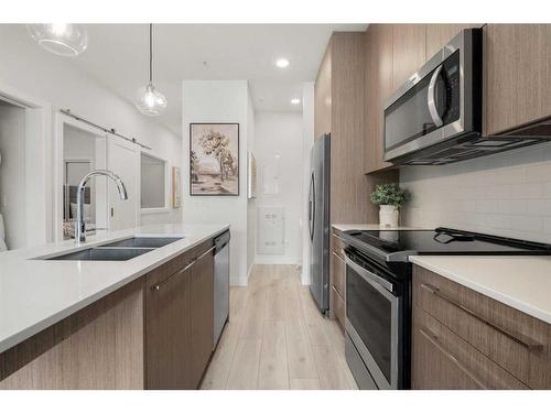 2221-76 Cornerstone Passage Ne, Calgary, AB - Indoor Photo Showing Kitchen With Double Sink With Upgraded Kitchen