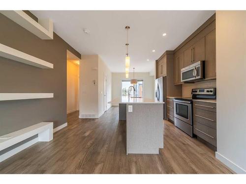 27-111 Rainbow Falls Gate, Chestermere, AB - Indoor Photo Showing Kitchen With Stainless Steel Kitchen With Upgraded Kitchen