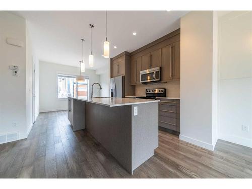 27-111 Rainbow Falls Gate, Chestermere, AB - Indoor Photo Showing Kitchen With Upgraded Kitchen