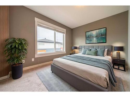 27-111 Rainbow Falls Gate, Chestermere, AB - Indoor Photo Showing Bedroom