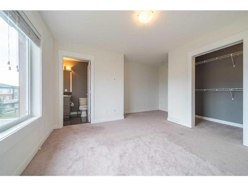 27-111 Rainbow Falls Gate, Chestermere, AB - Indoor Photo Showing Other Room