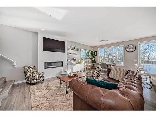 66 Howse Common Ne, Calgary, AB - Indoor Photo Showing Living Room With Fireplace