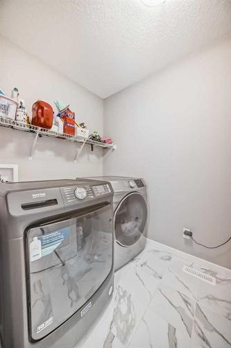 66 Howse Common Ne, Calgary, AB - Indoor Photo Showing Laundry Room