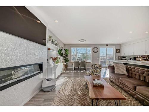 66 Howse Common Ne, Calgary, AB - Indoor Photo Showing Living Room With Fireplace