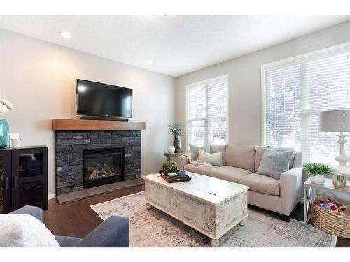 2060 New Brighton Grove Se, Calgary, AB - Indoor Photo Showing Living Room With Fireplace