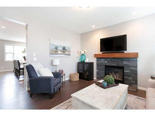 2060 New Brighton Grove Se, Calgary, AB - Indoor Photo Showing Living Room With Fireplace