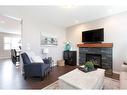 2060 New Brighton Grove Se, Calgary, AB  - Indoor Photo Showing Living Room With Fireplace 