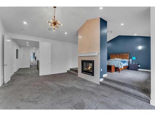 205 Kinniburgh Cove, Chestermere, AB - Indoor With Fireplace