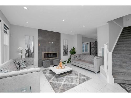 233 Crestmont Drive Sw, Calgary, AB - Indoor Photo Showing Living Room With Fireplace