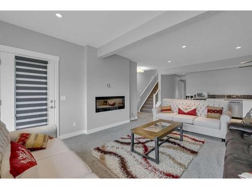 233 Crestmont Drive Sw, Calgary, AB - Indoor Photo Showing Living Room With Fireplace