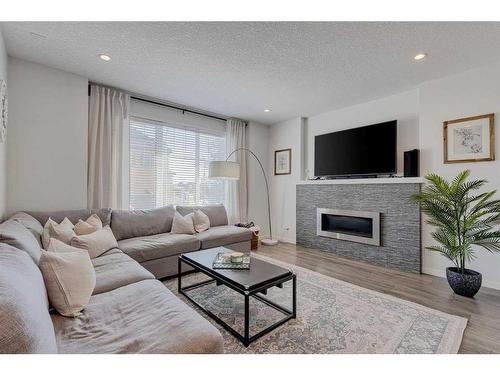 9 Marquis Link Se, Calgary, AB - Indoor Photo Showing Living Room With Fireplace