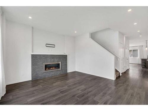 9 Marquis Link Se, Calgary, AB - Indoor Photo Showing Living Room With Fireplace