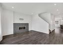 9 Marquis Link Se, Calgary, AB  - Indoor Photo Showing Living Room With Fireplace 