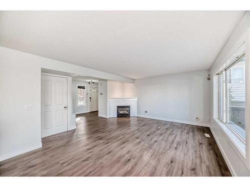 15 Coventry Circle Ne, Calgary, AB - Indoor Photo Showing Living Room With Fireplace