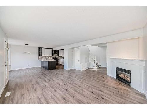 15 Coventry Circle Ne, Calgary, AB - Indoor Photo Showing Living Room With Fireplace