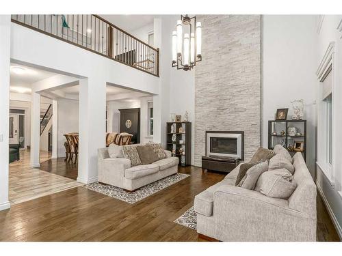 40 Masters Landing Se, Calgary, AB - Indoor Photo Showing Living Room With Fireplace