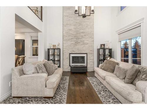 40 Masters Landing Se, Calgary, AB - Indoor Photo Showing Living Room With Fireplace