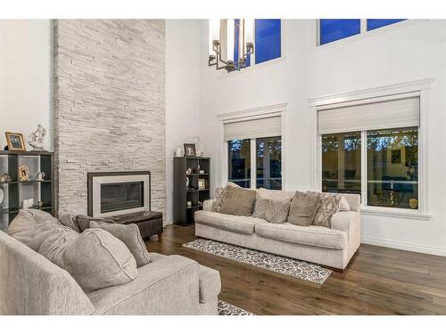 40 Masters Landing Se, Calgary, AB - Indoor Photo Showing Living Room With Fireplace