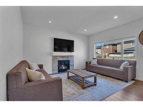 57 Saddlestone Green Ne, Calgary, AB - Indoor Photo Showing Living Room With Fireplace