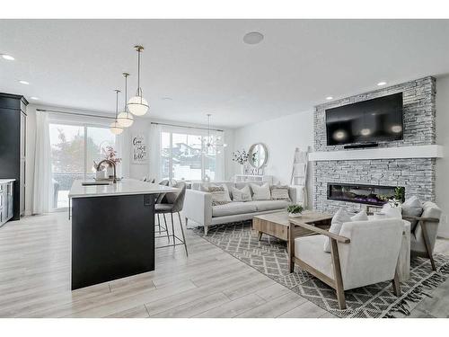 142 Seton Gardens Se, Calgary, AB - Indoor Photo Showing Living Room With Fireplace