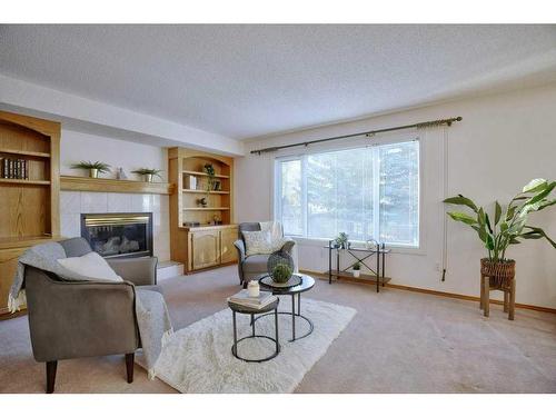 13 Mt Robson Close Se, Calgary, AB - Indoor Photo Showing Living Room With Fireplace