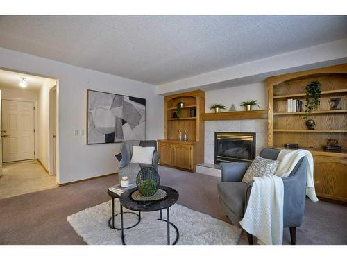 13 Mt Robson Close Se, Calgary, AB - Indoor Photo Showing Living Room With Fireplace