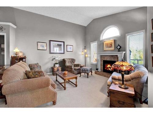 209 West Creek Springs, Chestermere, AB - Indoor Photo Showing Living Room With Fireplace