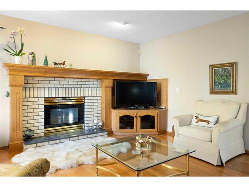 52 Arbour Ridge Way Nw, Calgary, AB - Indoor Photo Showing Living Room With Fireplace