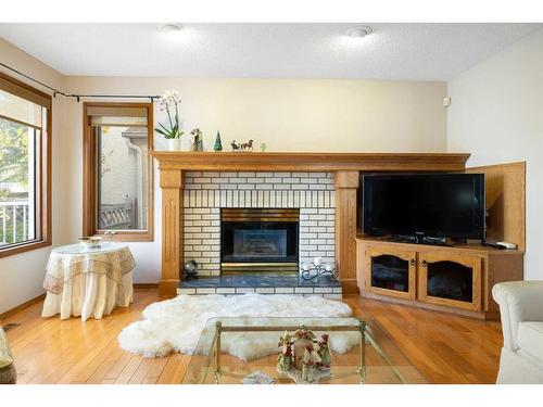 52 Arbour Ridge Way Nw, Calgary, AB - Indoor Photo Showing Living Room With Fireplace