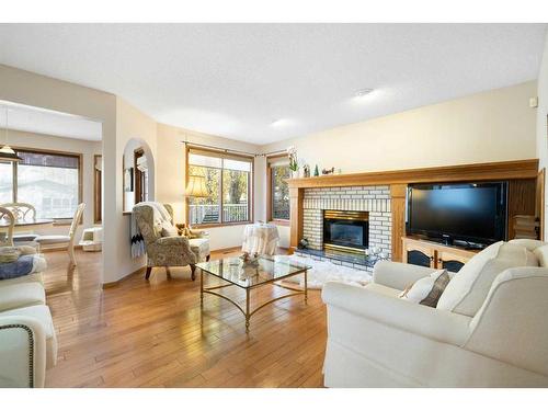 52 Arbour Ridge Way Nw, Calgary, AB - Indoor Photo Showing Living Room With Fireplace